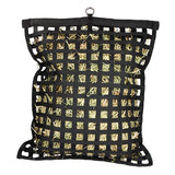 Black mesh bag filled with hay on a white background